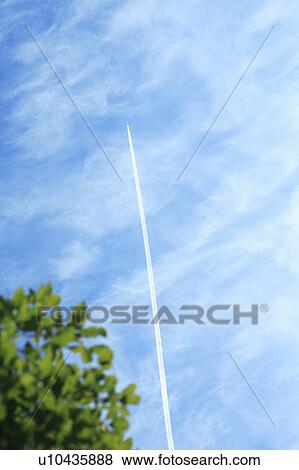 Stock Photo - Vapor trail in the sky. Fotosearch