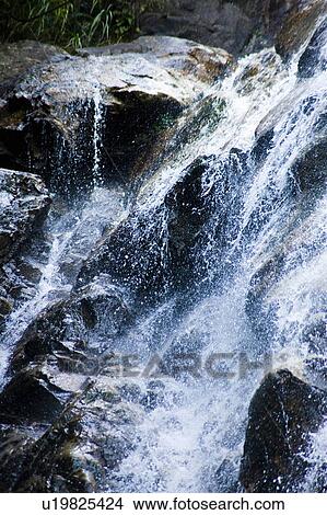 Water cascading down Yobai Waterfall, Otsu, Shiga Prefecture, Japan View Large Photo Image Picture - Water cascading down Yobai Waterfall, Otsu, Shiga Prefecture, Japan. Fotosearch
