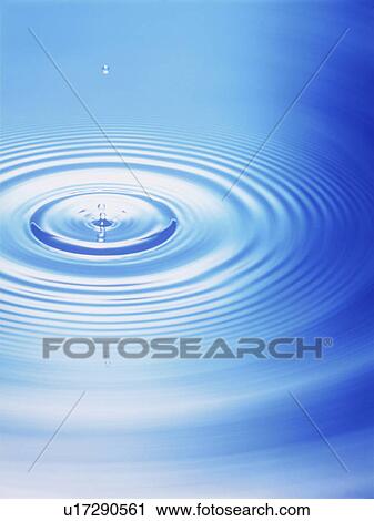 Stock Image - Water drop making ripple, close up. Fotosearch