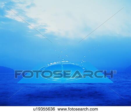 Stock Photograph - Water drop splashing over ocean and sky. Fotosearch