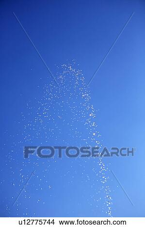 Water drops against blue sky, blue background View Large Photo Image Picture - Water drops against blue sky, blue background. Fotosearch