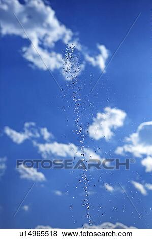 Water drops against blue sky View Large Photo Image Stock Photo - Water drops against blue sky. Fotosearch