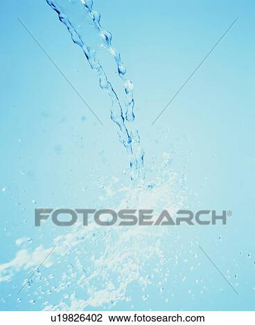 Stock Image - Water drops falling to surface. Fotosearch