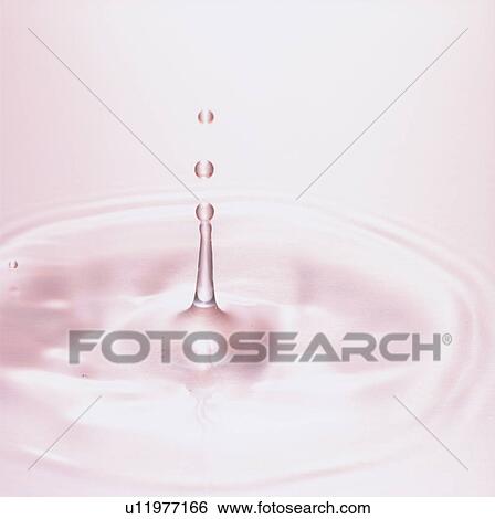Stock Photograph - Water drops making ripple, close up. Fotosearch