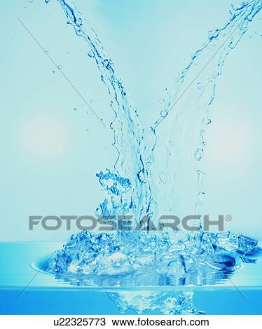 Stock Image - Water falling to surface. Fotosearch