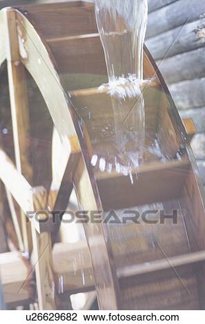 Water flowing onto wooden water wheel. Yokohama, Kanagawa Prefecture, Japan View Large Photo Image Stock Image - Water flowing onto wooden water wheel. Yokohama, Kanagawa Prefecture, Japan. Fotosearch