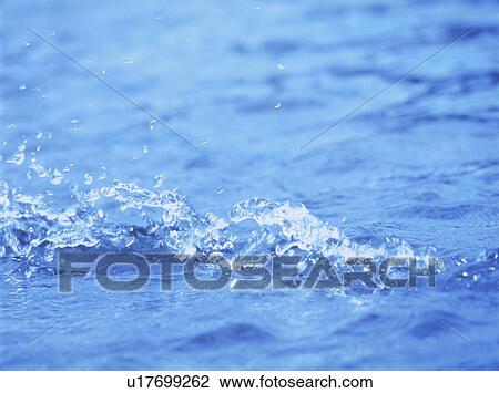 Stock Image - Water splashing, close up, full frame. Fotosearch