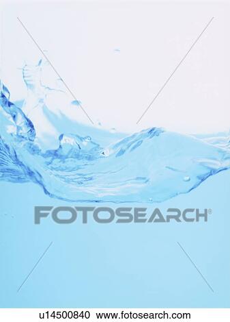 Stock Image - Water splashing, close up, white background. Fotosearch