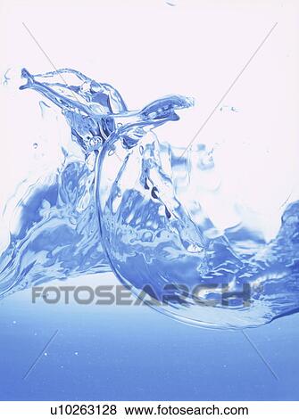 Stock Photo - Water splashing, close up, white background. Fotosearch