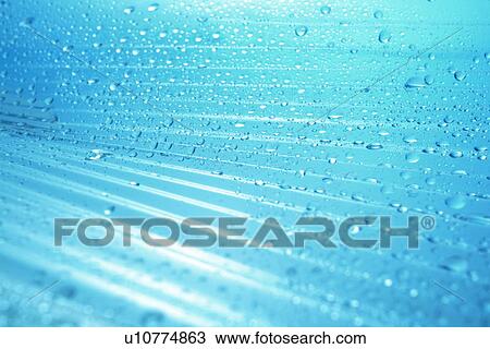 Stock Image - Waterdrops on blue surface. Fotosearch