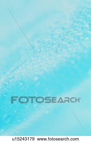 Stock Photo - Waterdrops on blue surface. Fotosearch