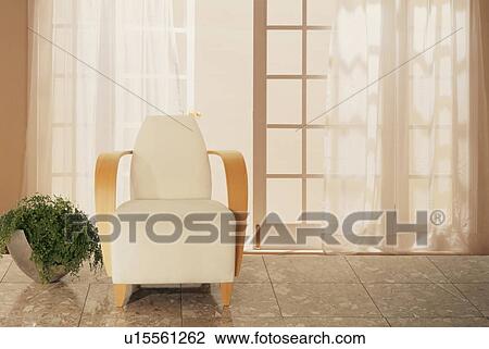 Stock Image - White armchair by glass doors with curtain. Fotosearch