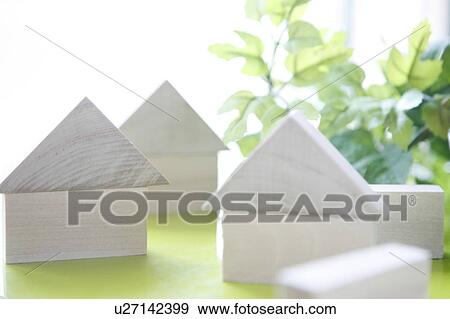 Stock Photo - White blocks stacked in house shapes. Fotosearch