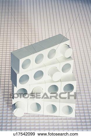 Stock Photo - White blocks with round holes. Fotosearch