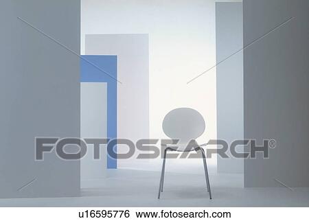 Stock Photograph - White chair in room with blue and white walls. Fotosearch