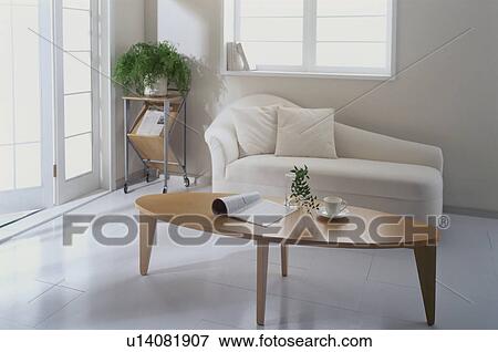 Stock Photo - White modern sofa and coffee table. Fotosearch