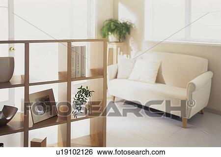 White sofa and shelf in sunny room View Large Photo Image Stock Photograph - White sofa and shelf in sunny room. Fotosearch