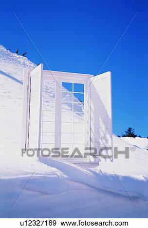 Stock Photo - White window and shutters on snowy mountain. Fotosearch
