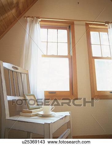 White wooden chair in attic room by window View Large Photo Image Stock Image - White wooden chair in attic room by window. Fotosearch
