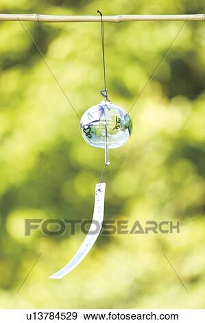 Wind chime hanging on bamboo stick View Large Photo Image Stock Photo - Wind chime hanging on bamboo stick. Fotosearch