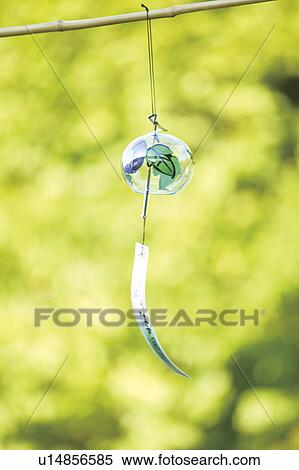 Wind chime hanging on bamboo stick View Large Photo Image Stock Photography - Wind chime hanging on bamboo stick. Fotosearch