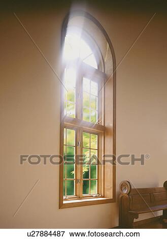 Stock Photo - Window in spacious room with pew. Fotosearch