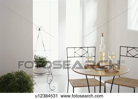 Wine bottle and glasses on table View Large Photo Image Stock Image - Wine bottle and glasses on table. Fotosearch