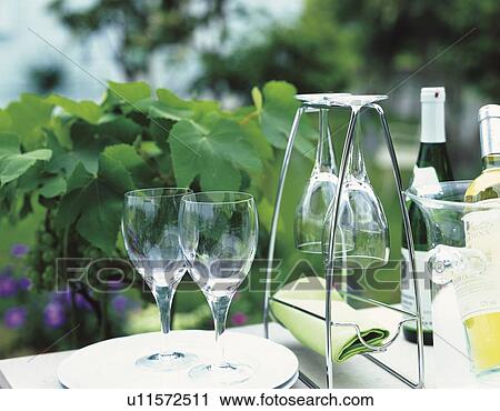 Wineglasses and bottles on an outdoor table View Large Photo Image Stock Image - Wineglasses and bottles on an outdoor table. Fotosearch