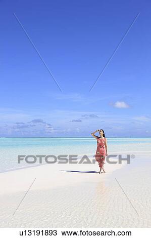 Woman at white sand beach, Maldive Islands View Large Photo Image Stock Image - Woman at white sand beach, Maldive Islands. Fotosearch