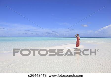 Woman at white sand beach, Maldive Islands View Large Photo Image Stock Image - Woman at white sand beach, Maldive Islands. Fotosearch