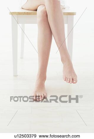 Woman crossing legs View Large Photo Image Stock Photo - Woman crossing legs. Fotosearch