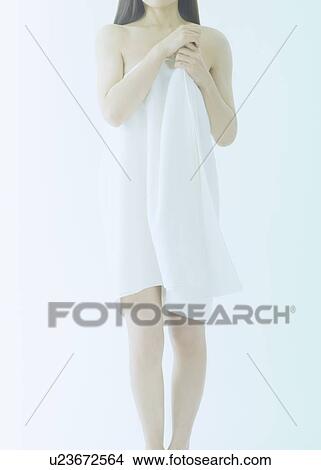 Picture - Woman wrapped in a white towel. Fotosearch