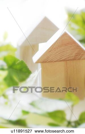 Wooden blocks stacked in house shapes View Large Photo Image Stock Photo - Wooden blocks stacked in house shapes. Fotosearch