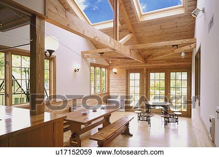 Stock Photo - Wooden building interior with table and chairs. Fotosearch