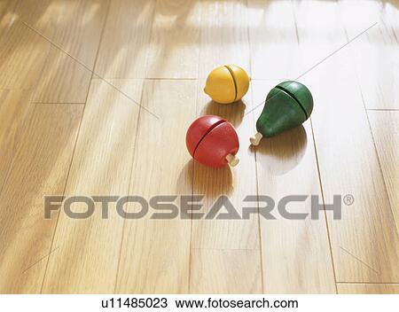 Stock Image - Wooden fruits on floor. Fotosearch