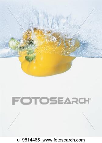 Yellow bell pepper falling into water View Large Photo Image Stock Photography - Yellow bell pepper falling into water. Fotosearch