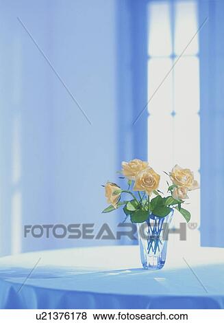 Yellow colored roses in vase on table View Large Photo Image Stock Photo - Yellow colored roses in vase on table. Fotosearch