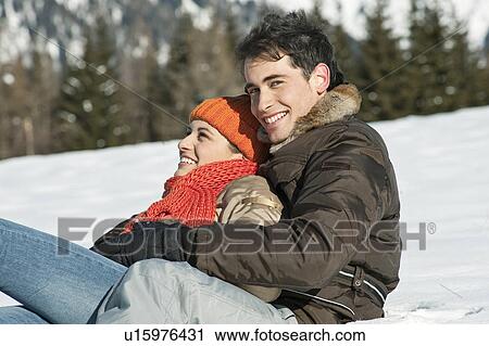 Couple embracing in winter scene View Large Photo Image Stock Image - Couple embracing in winter scene. Fotosearch