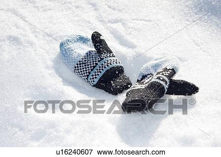 Stock Photo - Mittens in the snow. Fotosearch