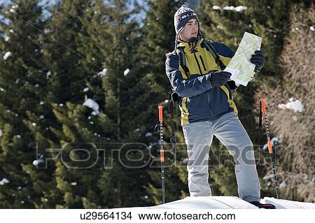 Young man in snow hiking View Large Photo Image Picture - Young man in snow hiking. Fotosearch