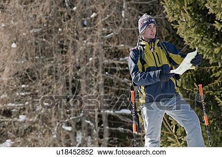 Young man in snow hiking View Large Photo Image Stock Image - Young man in snow hiking. Fotosearch