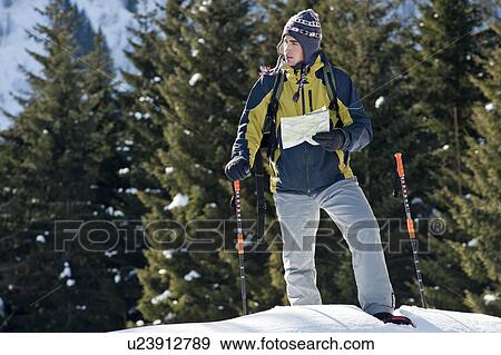 Young man in snow hiking View Large Photo Image Stock Photo - Young man in snow hiking. Fotosearch