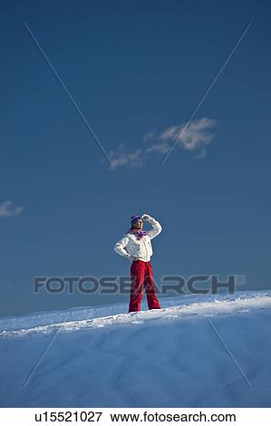 Young woman in snow looking View Large Photo Image Stock Photo - Young woman in snow looking. Fotosearch