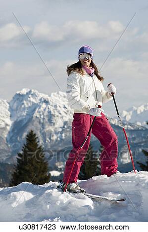 Young woman in snow skiing View Large Photo Image Stock Image - Young woman in snow skiing. Fotosearch