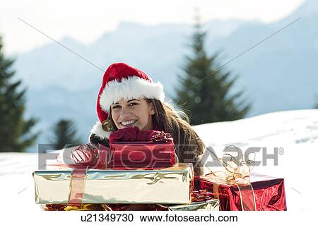 Young woman with Christmas presents in winter scene View Large Photo Image Stock Image - Young woman with Christmas presents in winter scene. Fotosearch