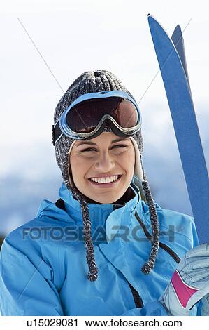Young woman with skis View Large Photo Image Stock Image - Young woman with skis. Fotosearch