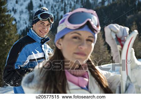 Stock Photography - Young woman with skis. Fotosearch