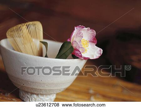 Stock Photo - A camellia, a teacup, and a bamboo whisk. Fotosearch