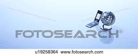 A globe and a mobile phone View Large Photo Image Picture - A globe and a mobile phone. Fotosearch
