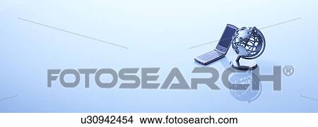 Picture - A globe and a mobile phone. Fotosearch